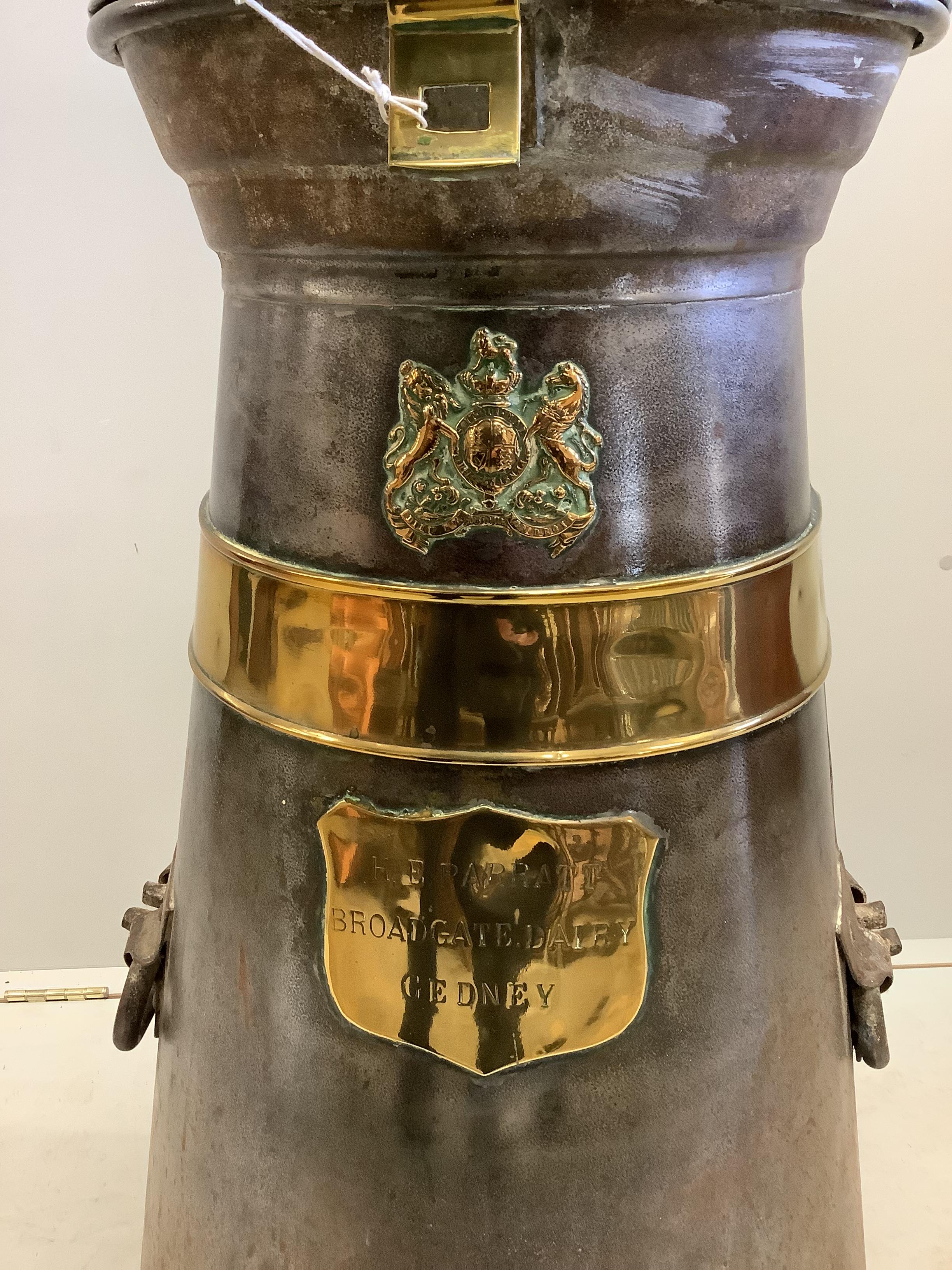 A Victorian brass mounted steel milk churn marked H.E. Parratt, Broadgate Dairy, Gedney, height 98cm